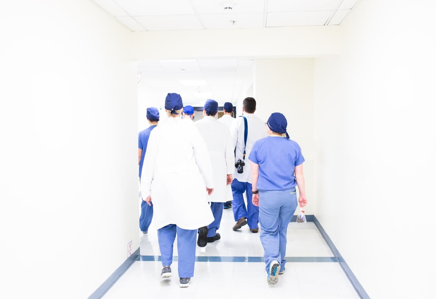 Care team consulting in a clinic corridor